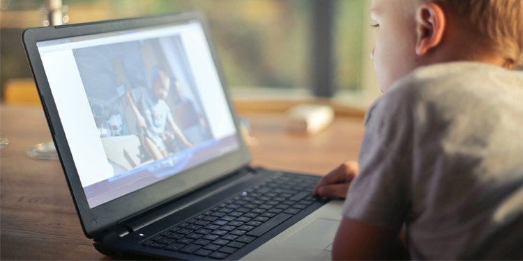 How Much Storage Do I Need On My Laptop 2 kid-watching-video-on-laptop